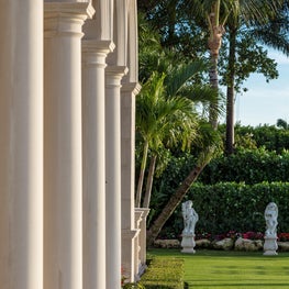 Limestone arcade overlooking the pool and formal gardens