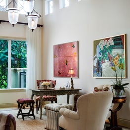 An antique desk in the living room serves as an office space.