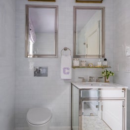 Bathroom with Mirrored Vanity and Purple Painted Ceiling 