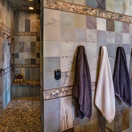 River rock inlays add another layer of contrast to unify the space.  