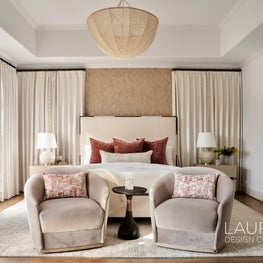 Sun-kissed neutrals fill the primary bedroom of University Place