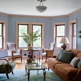 Eclectic Formal Living Room with Vintage Furniture and Upholstery