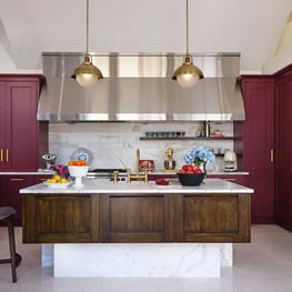 Renovated Wine and Walnut Kitchen with Island and Marble Countertops