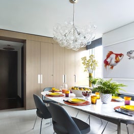 Eat in kitchen with clean and cheerful surfaces and modern furniture.