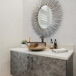 Expansive Decadent Waterfront, modern powder room, sliver cabinets, silver sunburst mirror, vessel sink