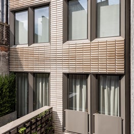 Upper East Side Townhouse, Rear facade in custom glazed terra cotta and terrace