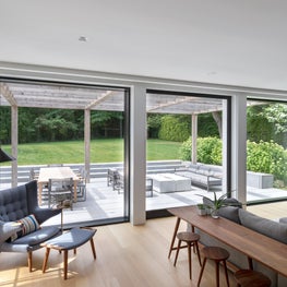 Family room with access to the terrace through a large lift and slide door