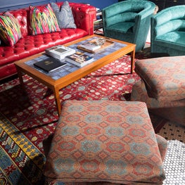 Men's Luxury Clothing Store - custom ottomans in the style of Billy Baldwin