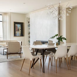 Modern Scandinavian living and dining room with Moooi LED chandelier