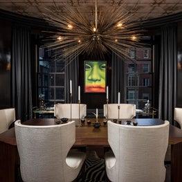Color, lighting and lacquered black walls add dimension to this dining room. 