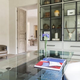 Timeless study with modern furniture & custom bookshelf; Houston, TX