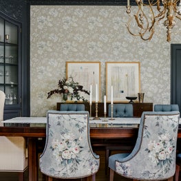 Craftsman dining room with modern art, floral wallpaper, built-in and sideboard