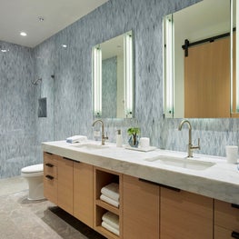 Tahoe Marvel, Kids bathroom with floating vanity and limestone floors.