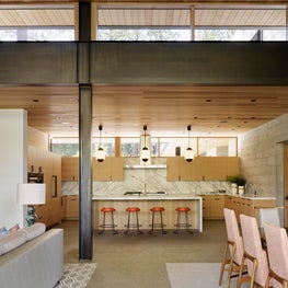 Tahoe Marvel, Kitchen with marble slab backsplash and waterfall island.