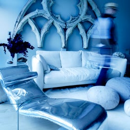Cool blues by the Highline / An old gothic window from a church hangs over this sexy lounge with a futuristic silver chaise lounge