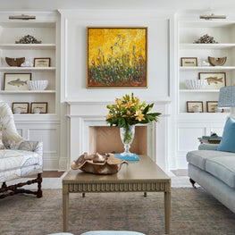 A contemporary living room with traditional elements with a soft color palette.