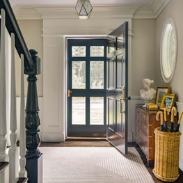 Sunny Entry and Foyer with Chest and Umbrella Stand