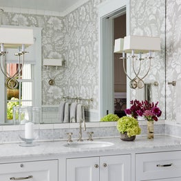 Three Barn Farm Bathroom. Chic farmhouse style with bright white and beige scheme & contemporary sconces on mirror wall.