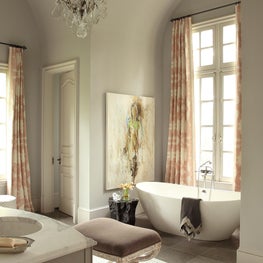 Atlanta Master Bath with vaulted ceiling and freestanding stone tub and original art