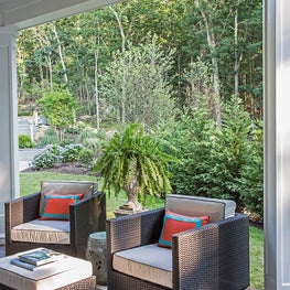 Hampton's porch with comfy club chairs