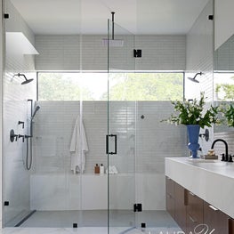 The primary bath of Braeswood Place is a lovely spot to enjoy some rest and relaxation.