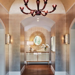 An entry wrapped in DeGournay wallpaper.