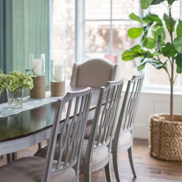 Bright breakfast room with floor-to-ceiling windows