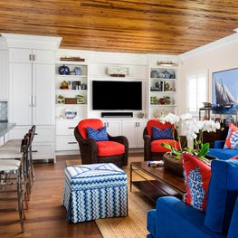 Warm pecky wood ceilings in this open plan family room and kitchen add warmth.