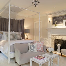 White and Grey Guest Bedroom with Canopy Bed and Fireplace
