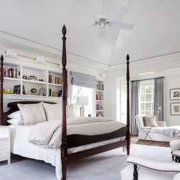 Tonal blues create a serene master bedroom. 