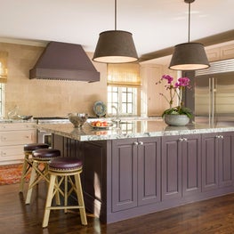 A neutral kitchen with a purple island!