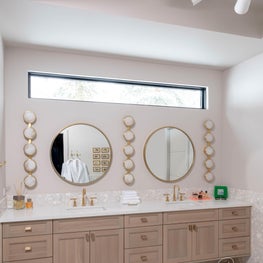A beautiful clerestory window above the vanity allows natural light to pour into the primary bath.