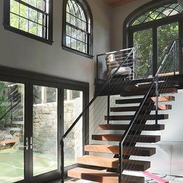 Chestnut Hill Recreation Barn Modern Staircase with Chandelier