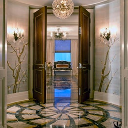 Round foyer with marble patterned floor & hand painted silk wallpaper