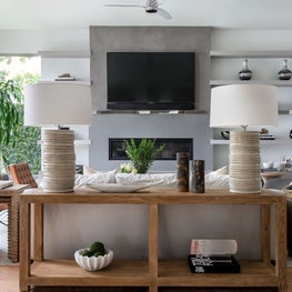 Portfolio: Modern living room with rustic wood console and chic natural tones