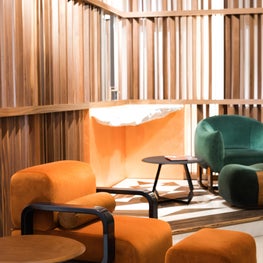 Cayenne Chair and ottoman, Queen pendant Lamp, Fetish Table - Showroom Vignette 