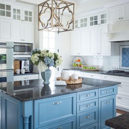 White kitchen with blue island