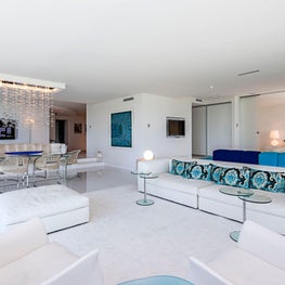 Contemporary Vacation Home with blue and white furnishings and patterned pillows