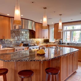 Totally custom kitchen with three different woods and two counter top materials