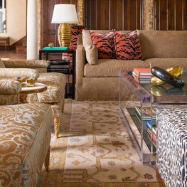 Modern gold accessories and details add richness to this room