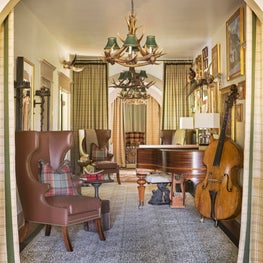 Music lounge featuring an eclectic collection of art and musical instruments