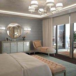 The chaise lounge overlooks the outdoor balcony and city beyond.