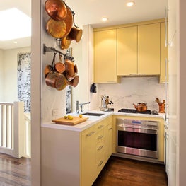 Warm kitchen with yellow cabinetry