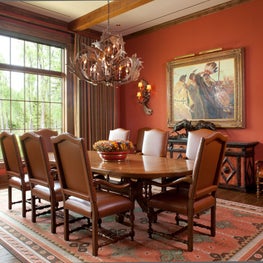 Western inspired dining room with horn chandelier and lighting accents.