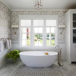 Three Barn Farm Bathroom. Chic farmhouse style with neutral printed wallpaper & freestanding tub.