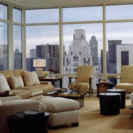 NYC Living Room with breathtaking city views, timeless mix of furniture styles.