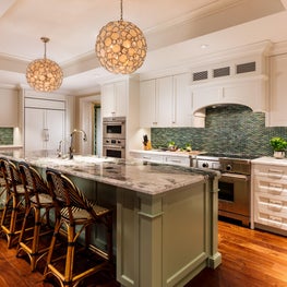 By adding greens to this kitchen, it created a sophisticated tropical feel.