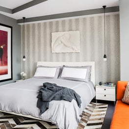 Master bedroom with snakeskin wallcovering and hide carpet