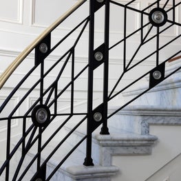 A modern take on a classical Georgian railing, rendered in bronze and pewter.