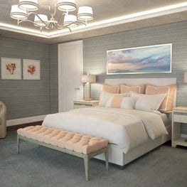 A tufted bench rests beneath the delicate silver chandelier adding glamour.